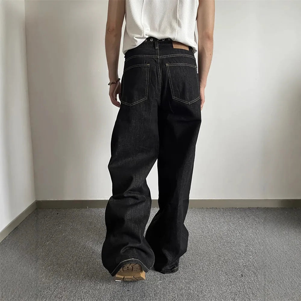 Black loose wide-leg retro jeans with a straight-leg cut and zip fly.