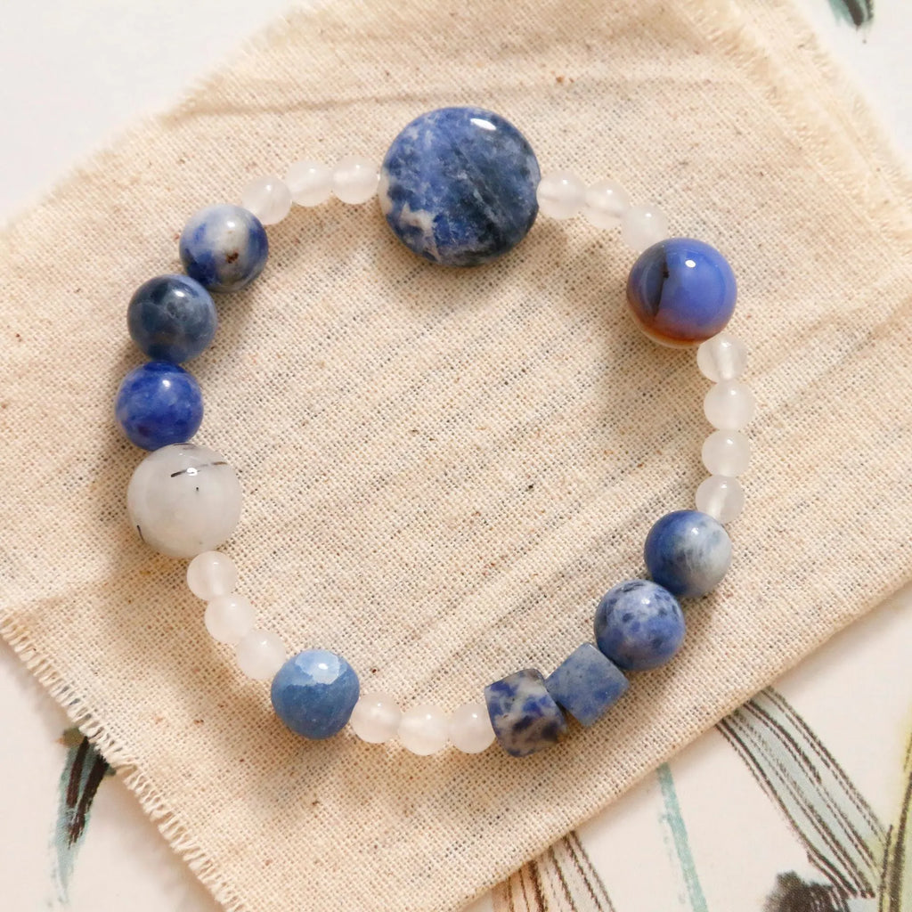 Hand-woven natural stone bracelet with blue point stone and black hair crystal agate beads