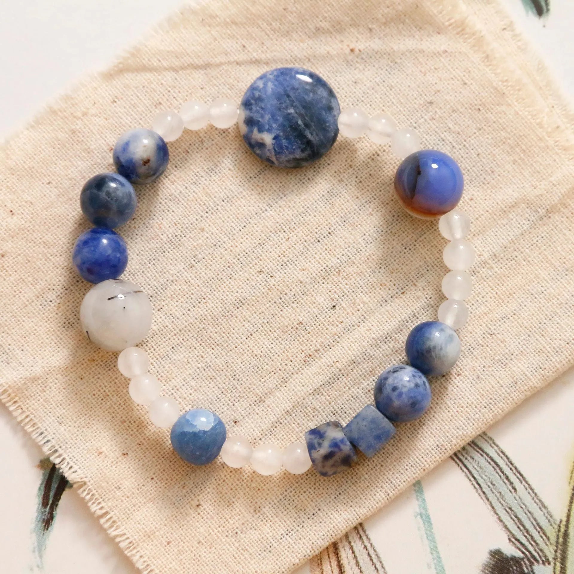 Hand-woven natural stone bracelet with blue point stone and black hair crystal agate beads