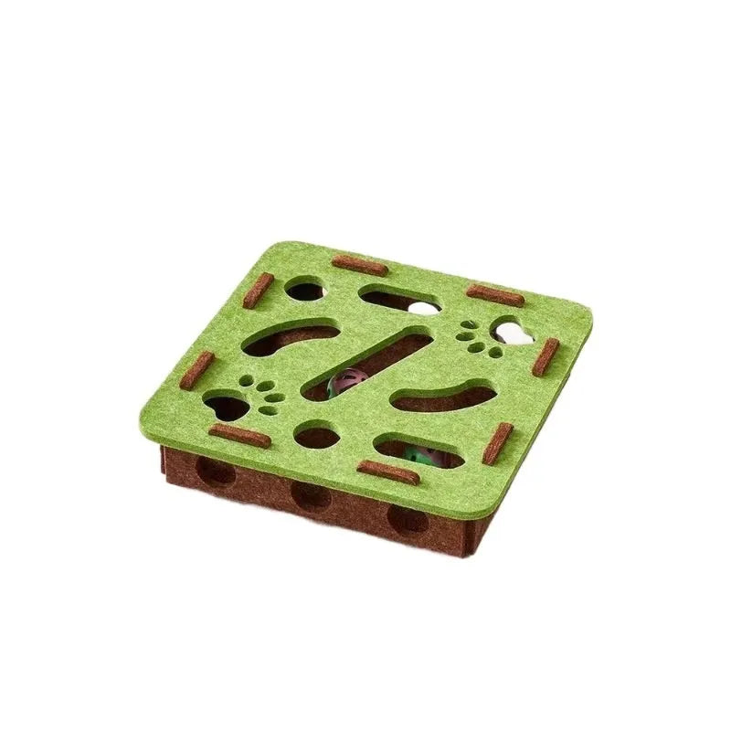 Green brown felt cat toy box with a square hole, measuring 30 cm, on a wooden floor.