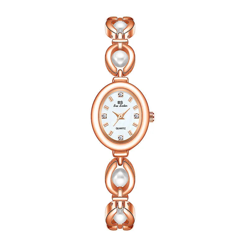 Women's quartz fashion bracelet watch with alloy case and pointer display, gold strap with white surface