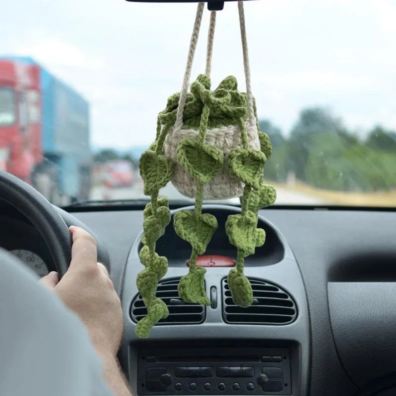 Green and white knitted wool car plant decoration with basin base and hanging rope