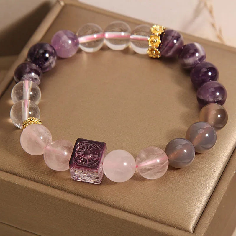 Purple women's bracelet with natural amethyst stones and rhinestones on a 10mm wide crystal band.
