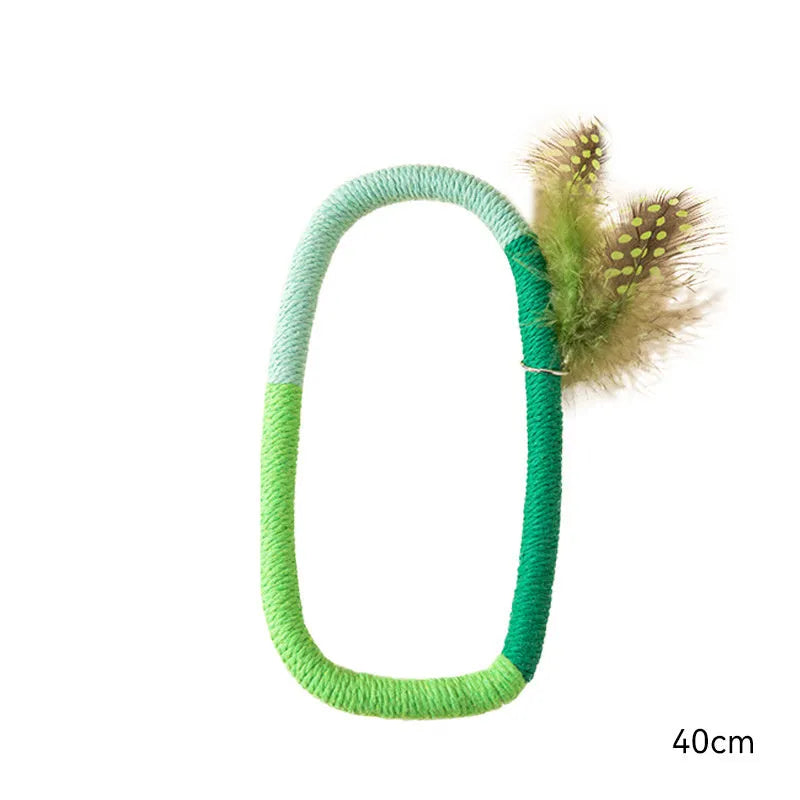 Green circular cotton rope cat toy with feathers attached, shown next to purple version