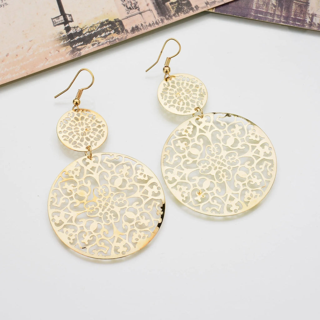 Women's gold round hollow dangle earrings made from zinc alloy, 4.5 by 8 cm, one pair
