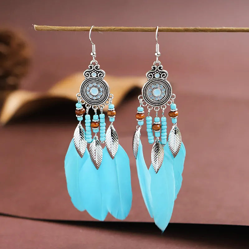 Bohemian style round drop feather earrings with leaf design in alloy, showing electroplated finish.