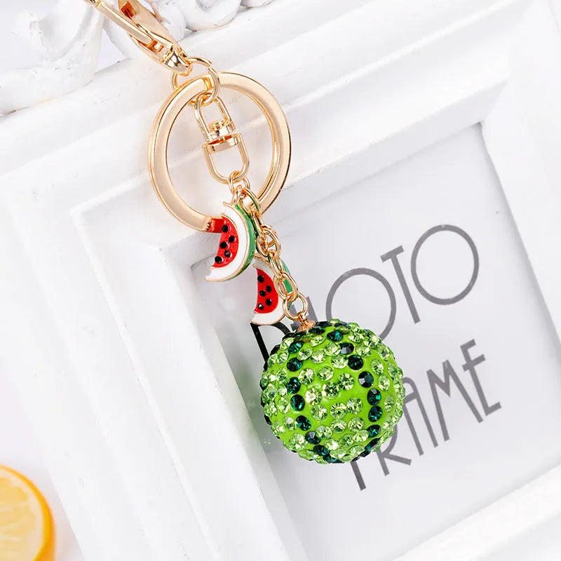 Green zinc alloy watermelon-shaped keychain, 12 cm long.