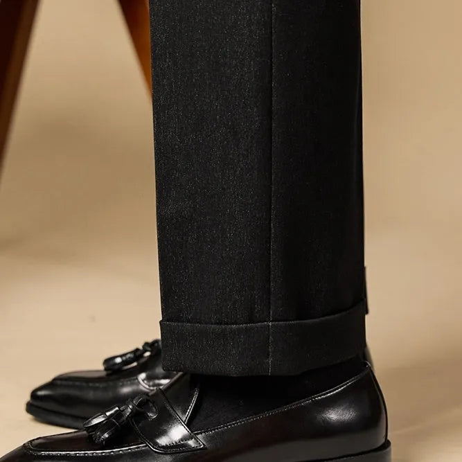 British-style leather tassel loafers in black or brown with polished uppers and traditional tassel detailing