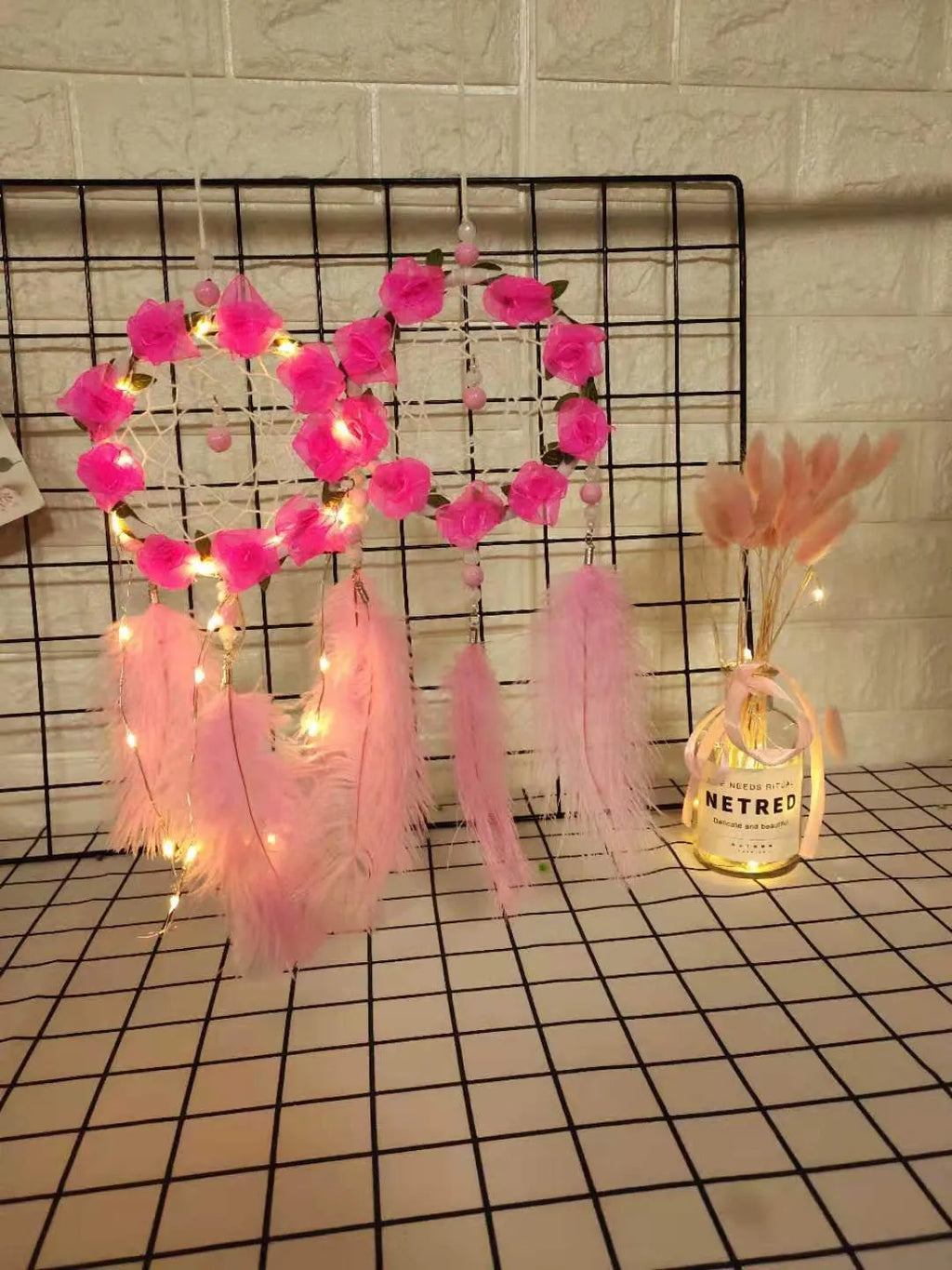 Pink ostrich feather dreamcatcher wind chime ornament measuring 10cm for wall decoration