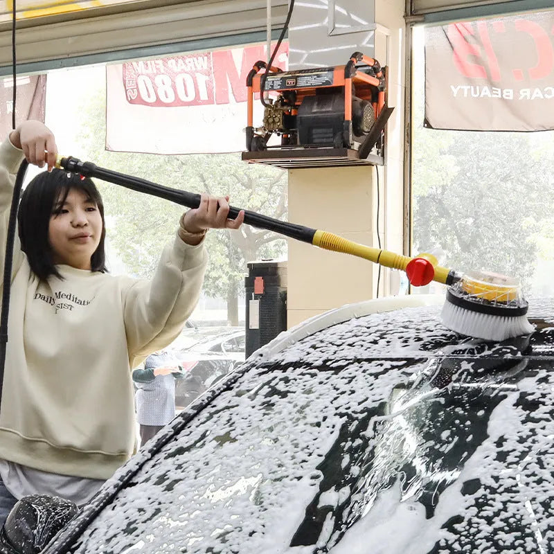 Yellow car wash mop cleaning tool with a long handle and chenille brush head.