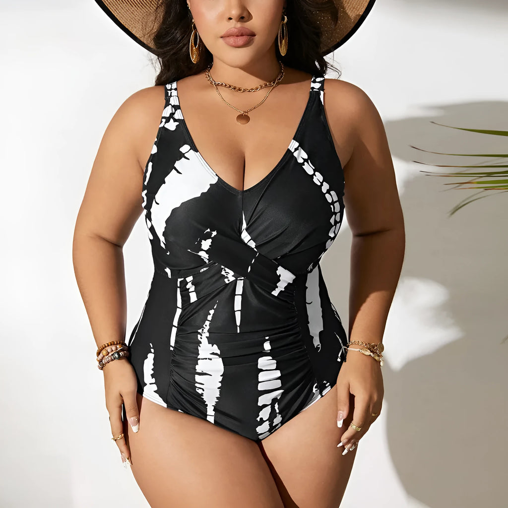 Black colour matching one-piece swimsuit with conservative cut and sleeveless design on mannequin