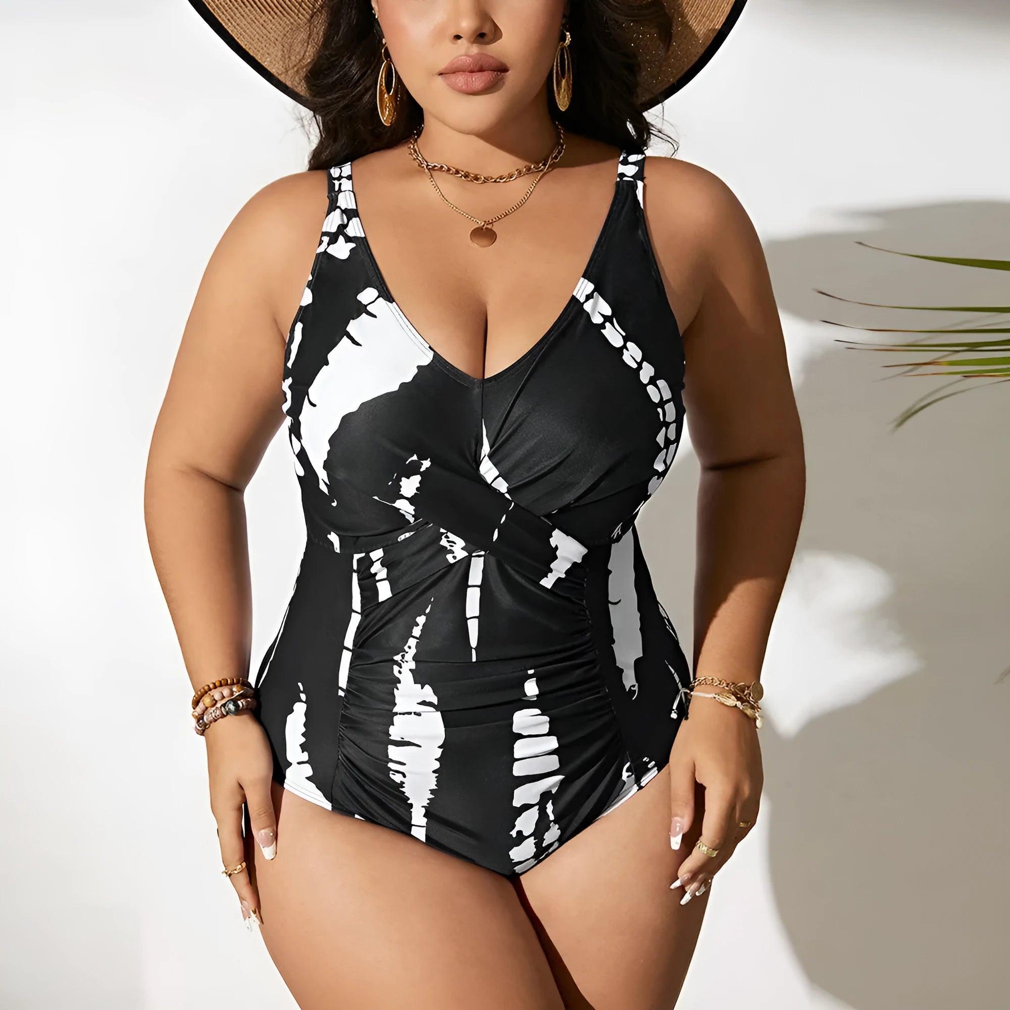 Black colour matching one-piece swimsuit with conservative cut and sleeveless design on mannequin
