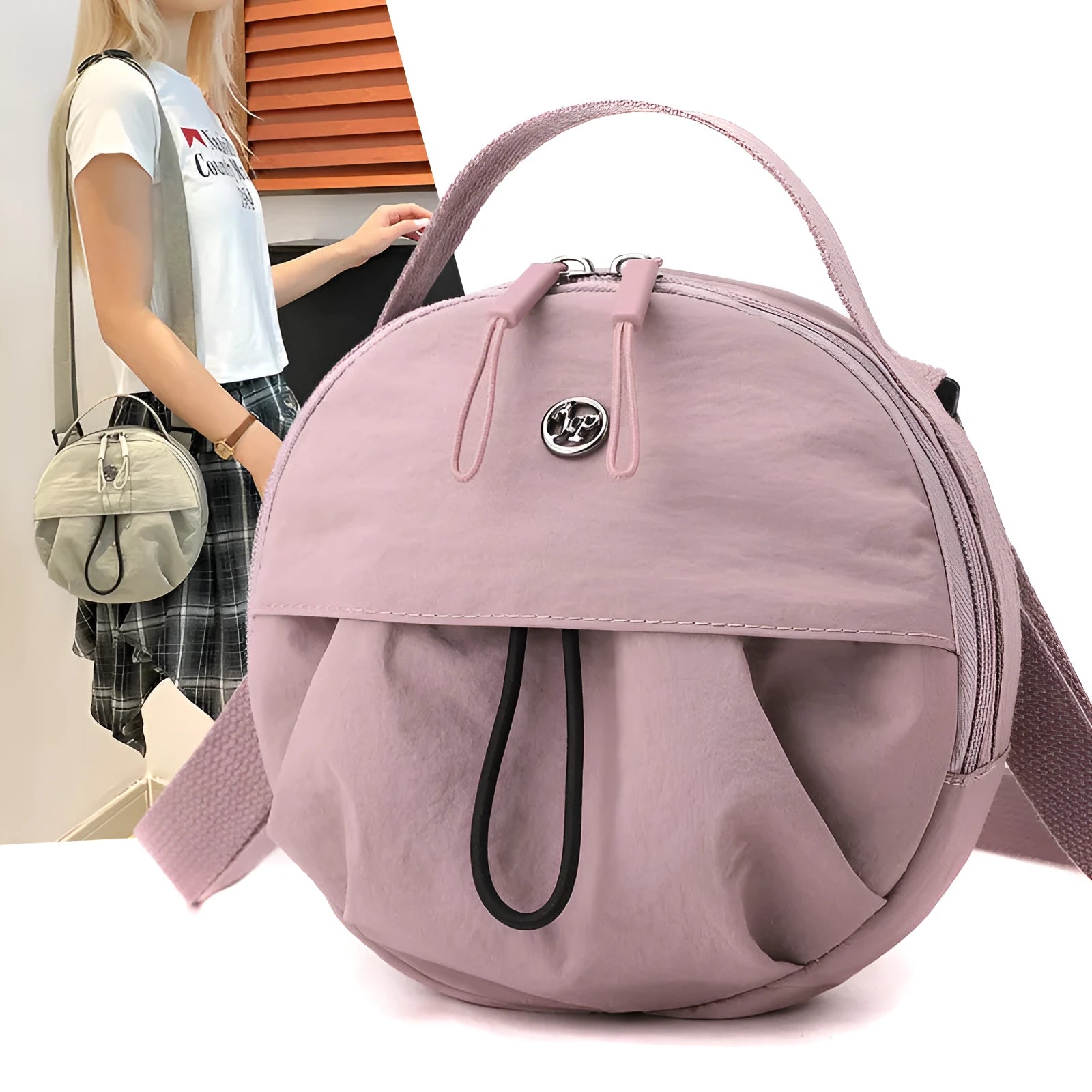 Nylon messenger crossbody bag with out shoulder design showing internal phone and document compartments