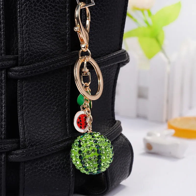 Green watermelon-shaped zinc alloy keychain charm measuring 12cm