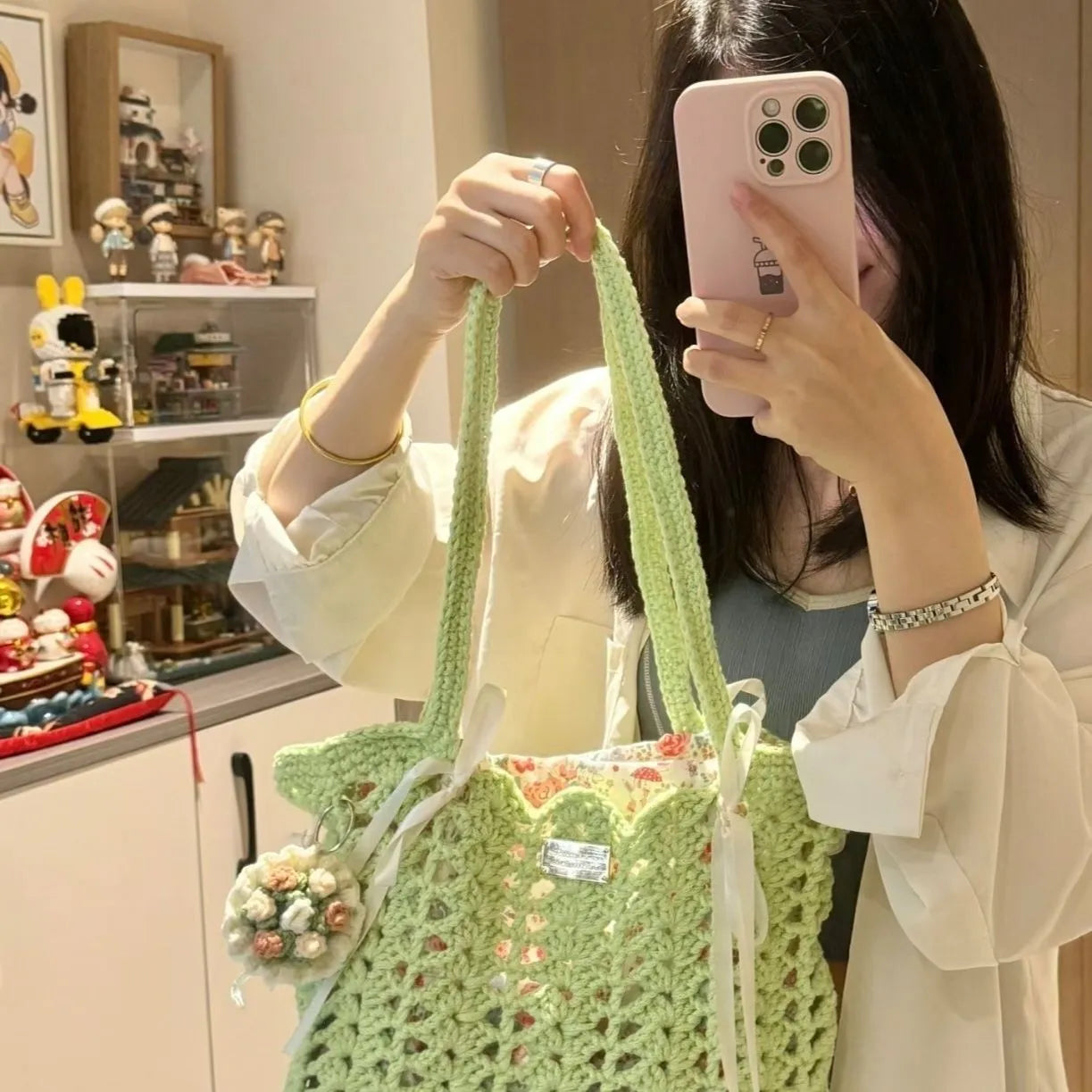 Handwoven wool summer tote bag with a floral patterned design.