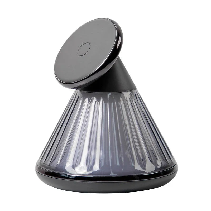 Champagne gold night table lamp with integrated magnetic wireless charging seat on its base.
