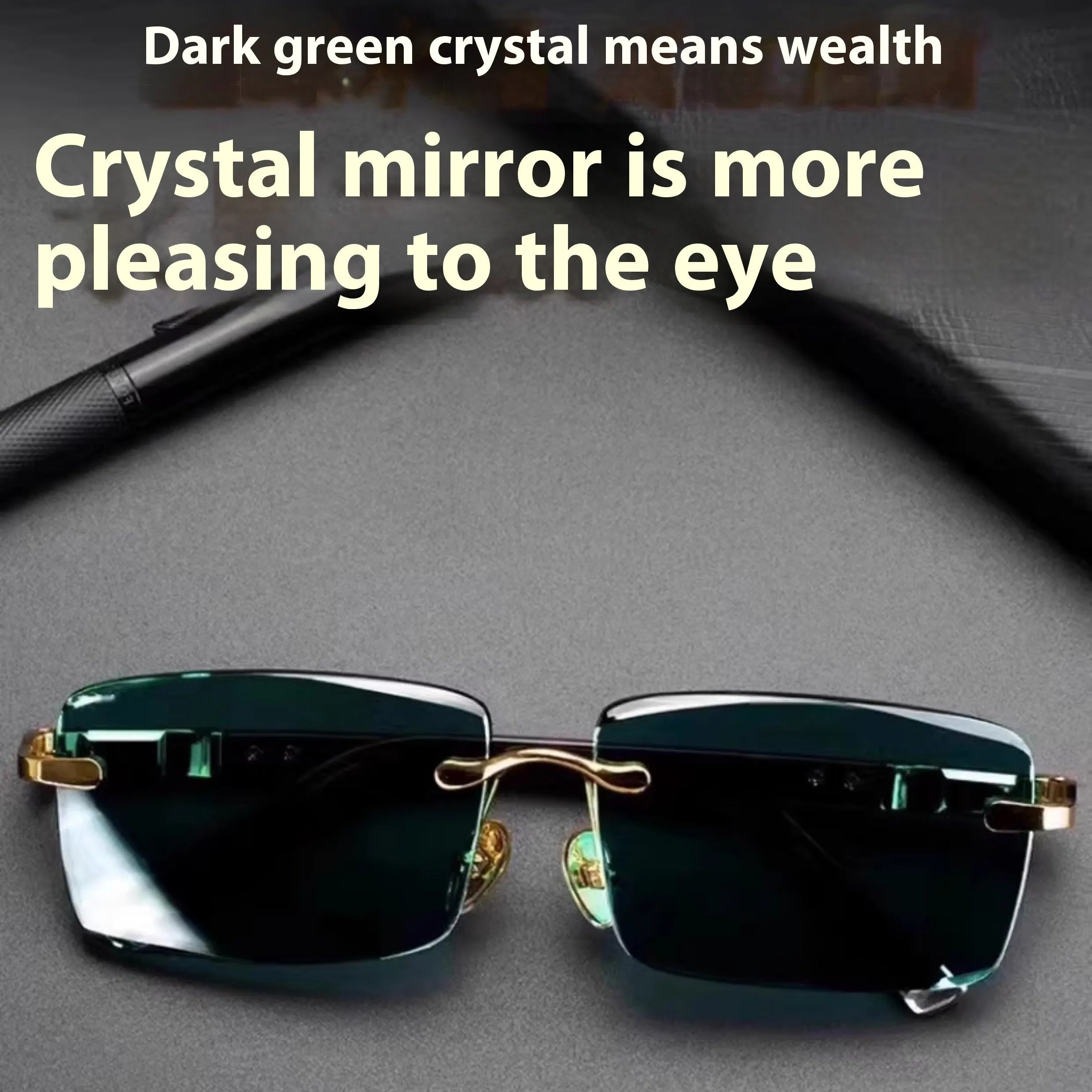Frameless dark green crystal sunglasses with minimalist design on a case with cleaning cloth.