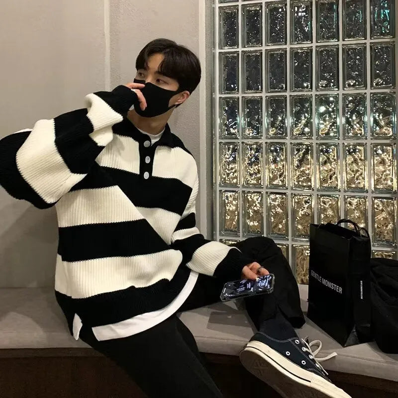 Men's loose fit black and grey striped sweater coat with long sleeves and pullover design
