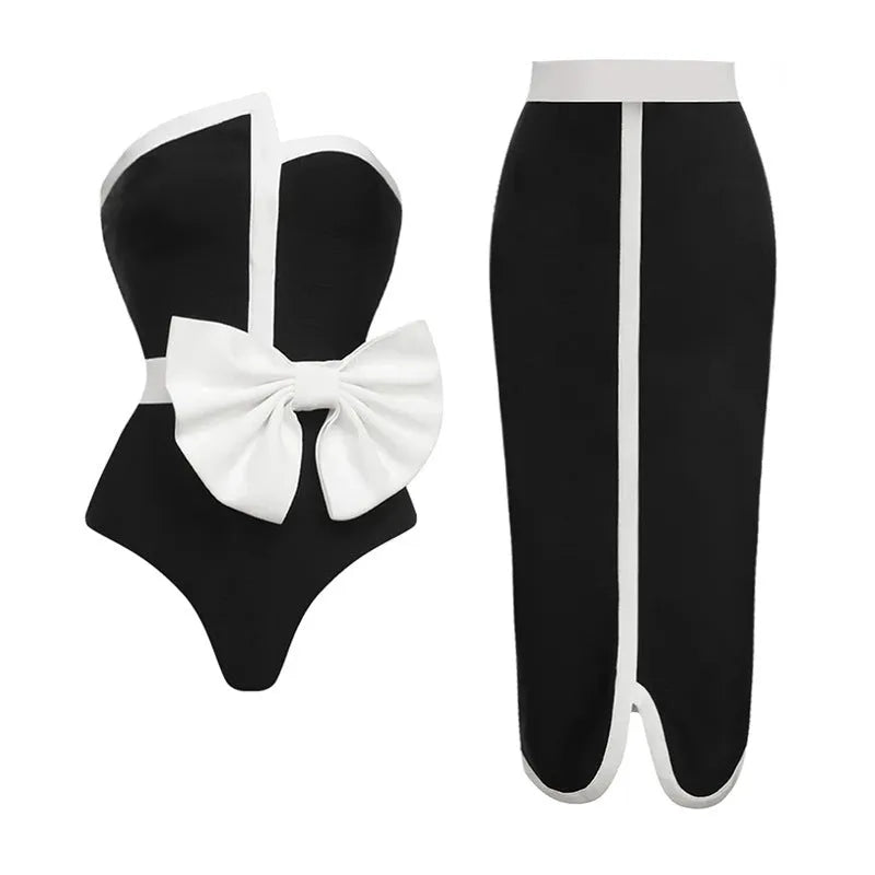 Black and white colour-block women's one-piece swimsuit with an asymmetrical bow on the tube top.