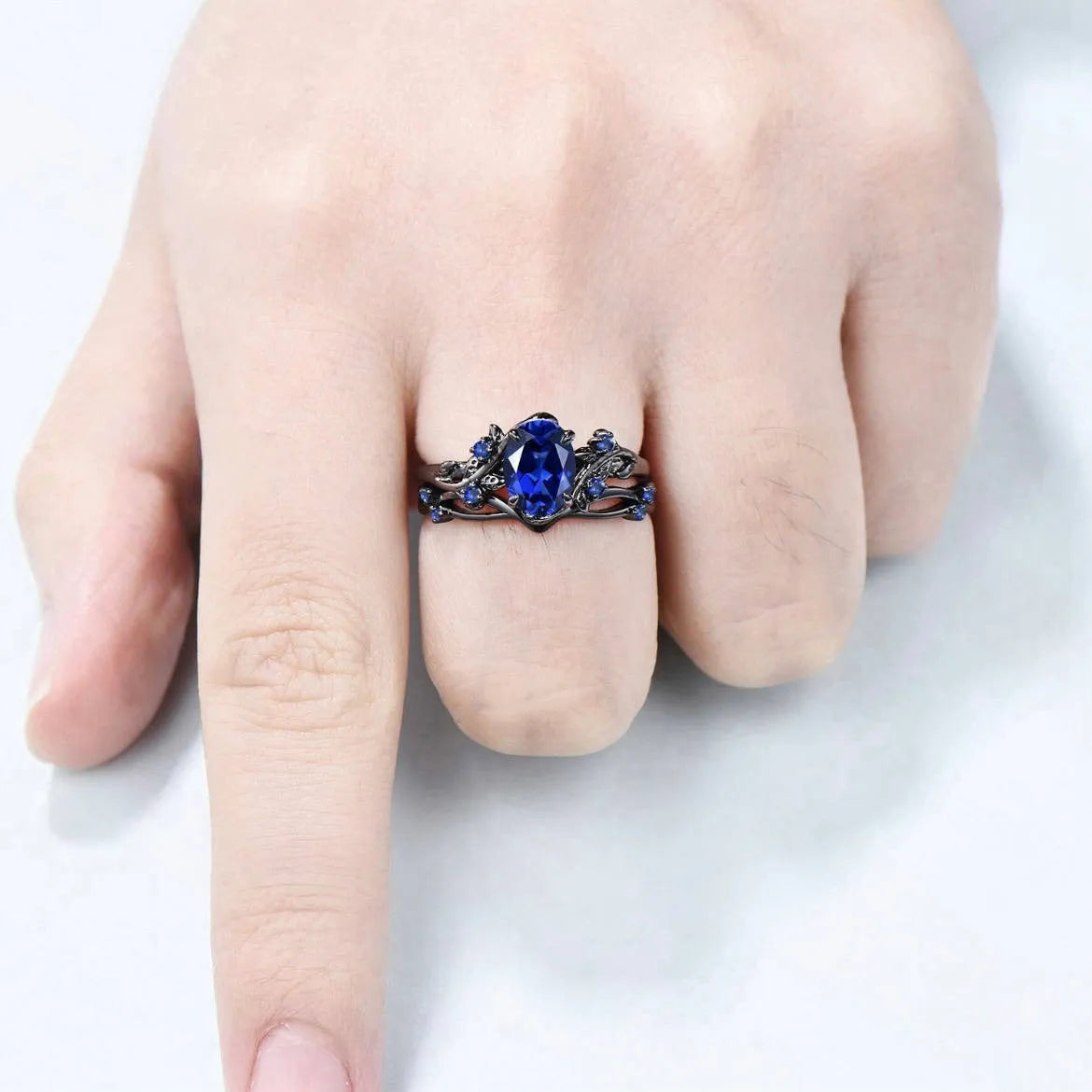 Gun black women's couple ring with navy blue rhinestone inlay on geometric copper band