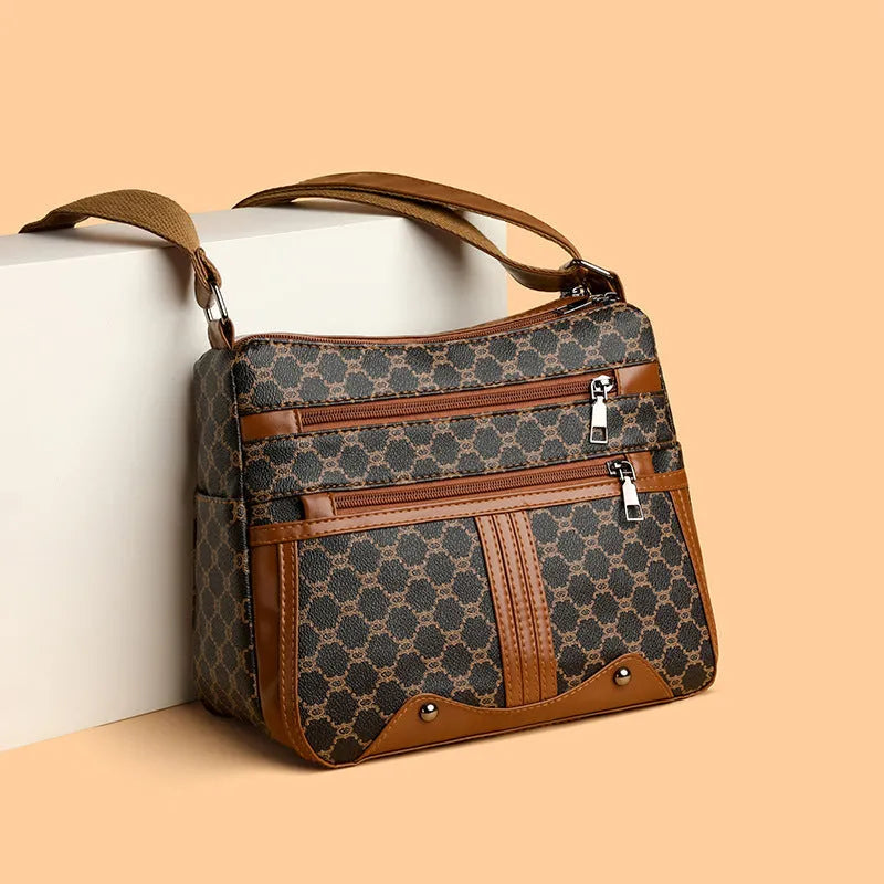 Brown women's crossbody bag with textured stitching pattern and adjustable strap showing interior polyester lining