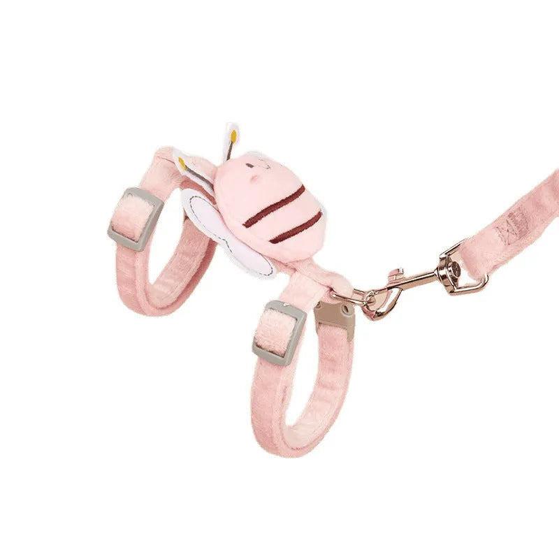 Pink adjustable bee-shaped cat leash with a teddy texture handle for outdoor walks.
