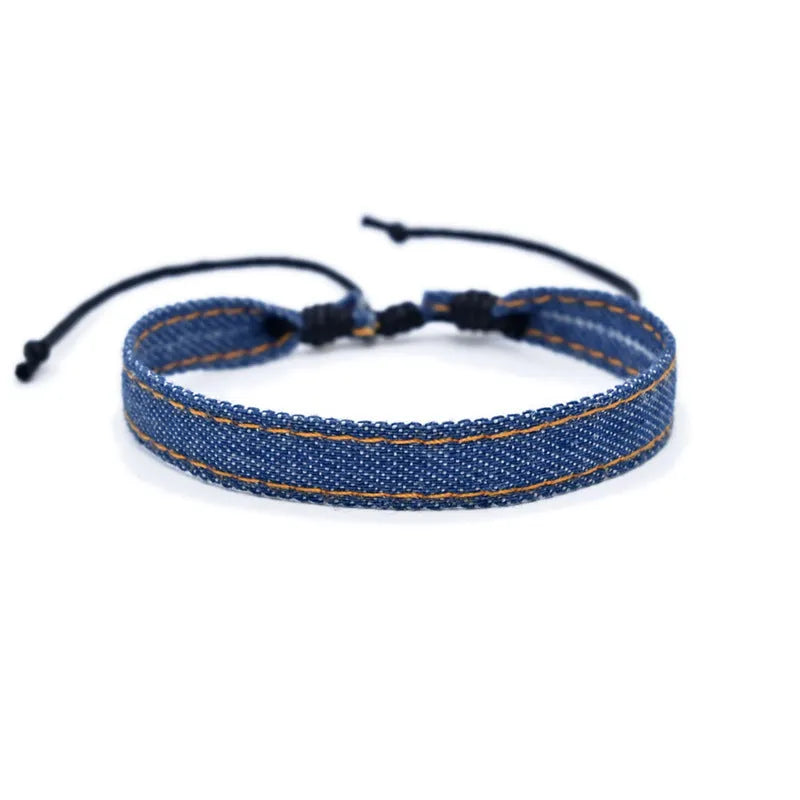 Handmade denim bracelet carrying strap shown in one of eleven available colour options with mixed material construction