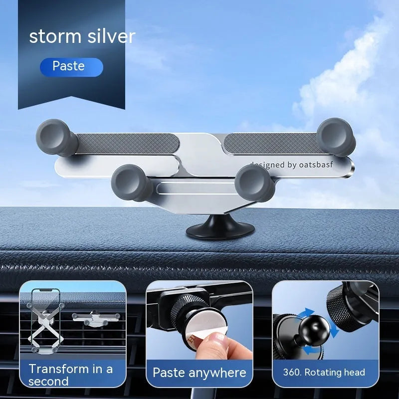 Silver aluminium alloy car phone holder with snap-on bracket mounted on a car air vent