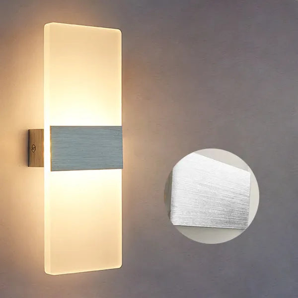 Modern acrylic LED wall lamp in black gold or silver with dual warm white light colours
