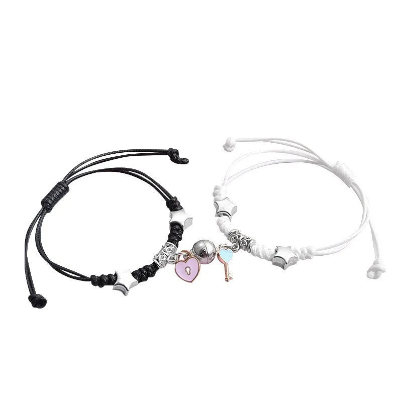 A pair of magnet couple bracelets in alloy with electroplated finish, showing styles like crown, clover, and love lock.