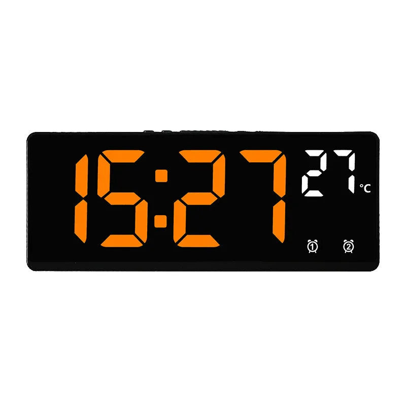 Large screen electronic LED alarm clock showing time and temperature, in a black acrylic casing.