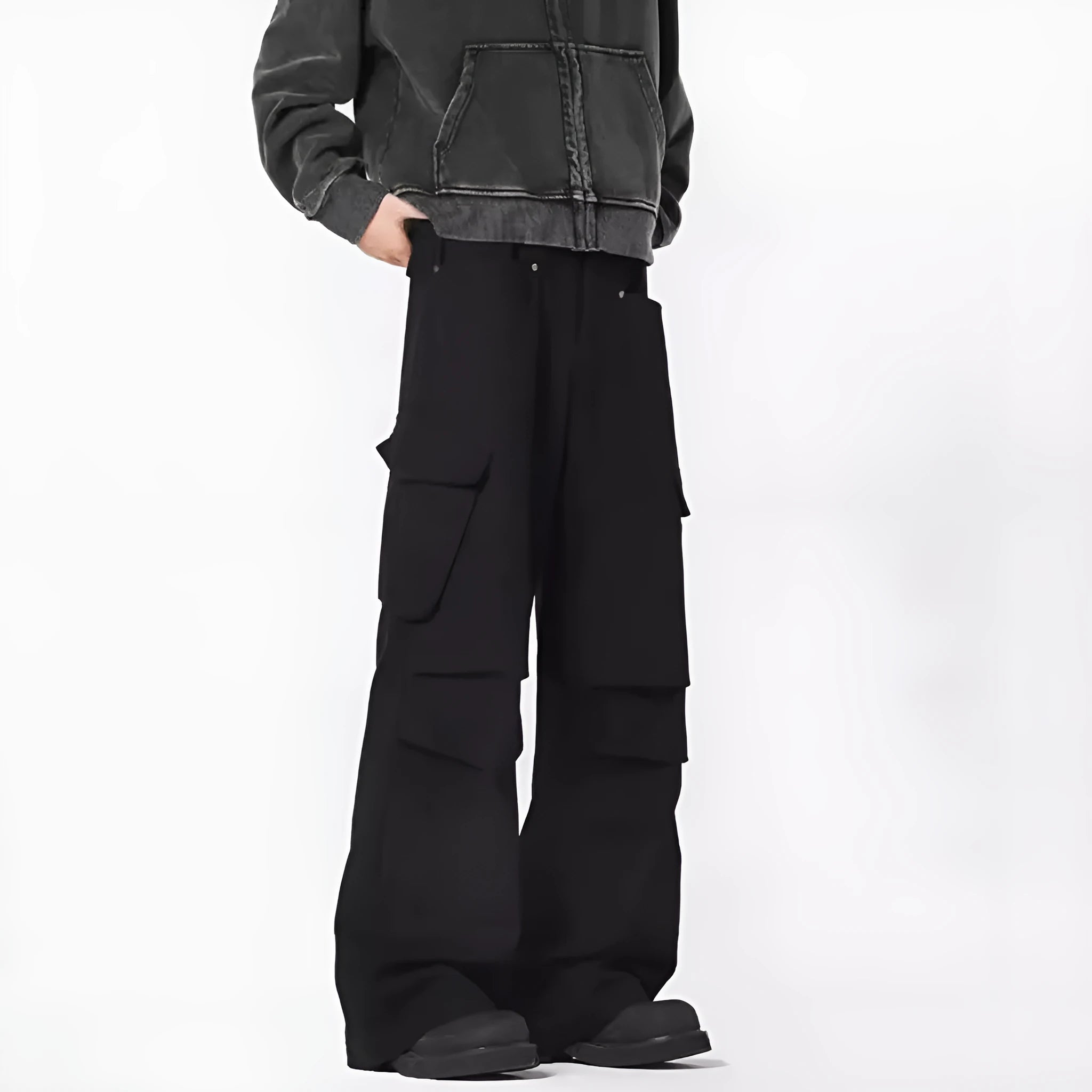 Man wearing retro style high-waisted straight leg casual trousers in black.