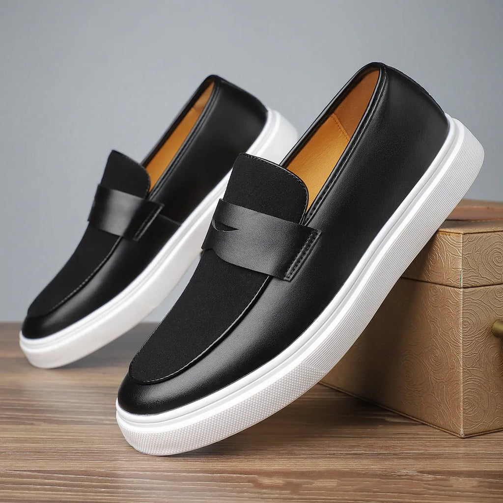 Black men's slip-on casual shoes with tassel detailing and a round toe