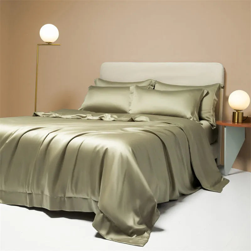 Aurora Blue 200 thread count Tencel duvet cover, fitted sheet, and pillowcases laid on a modern bed.