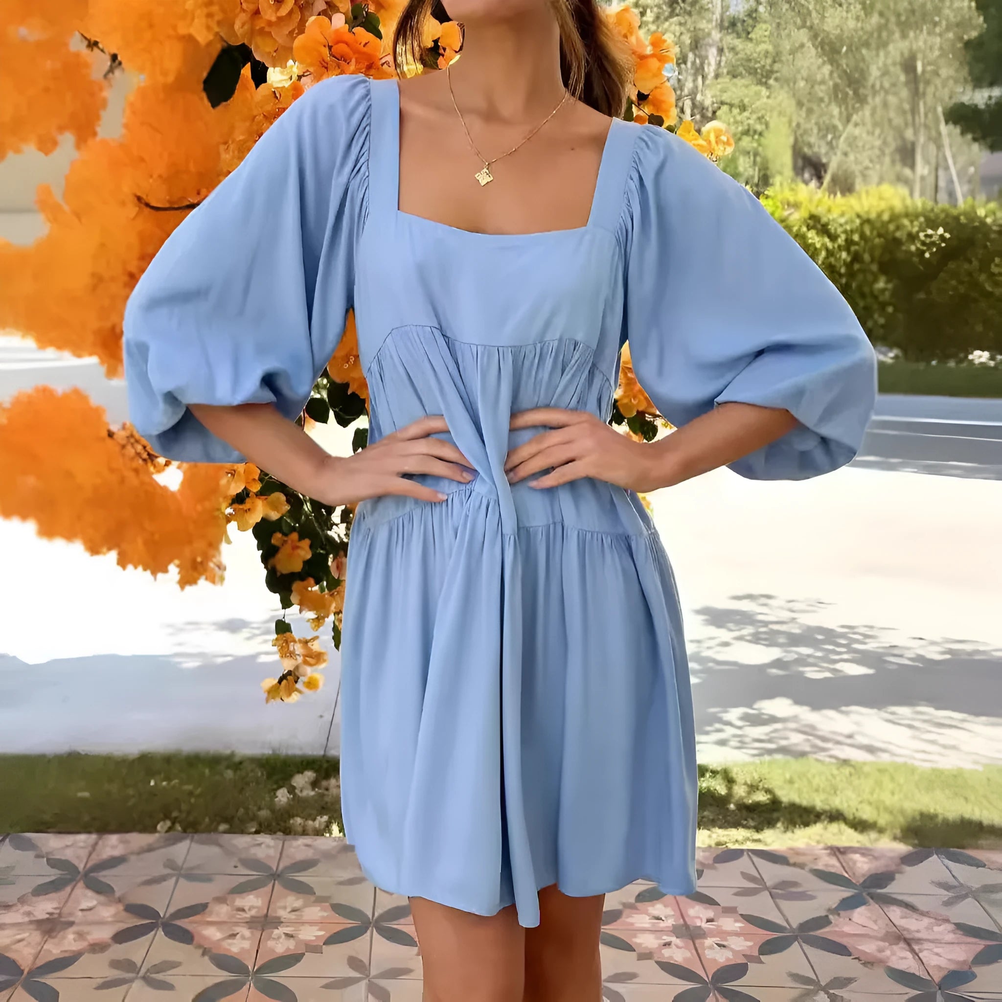 Orange children's pullover dress with square collar, puff sleeves, and backless A-line design.
