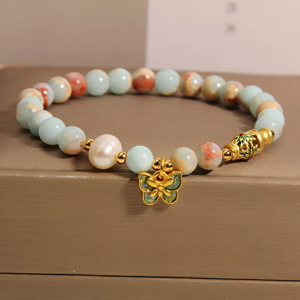 Blue women's bracelet with Shoushan stone, freshwater pearls and butterfly charm pendant