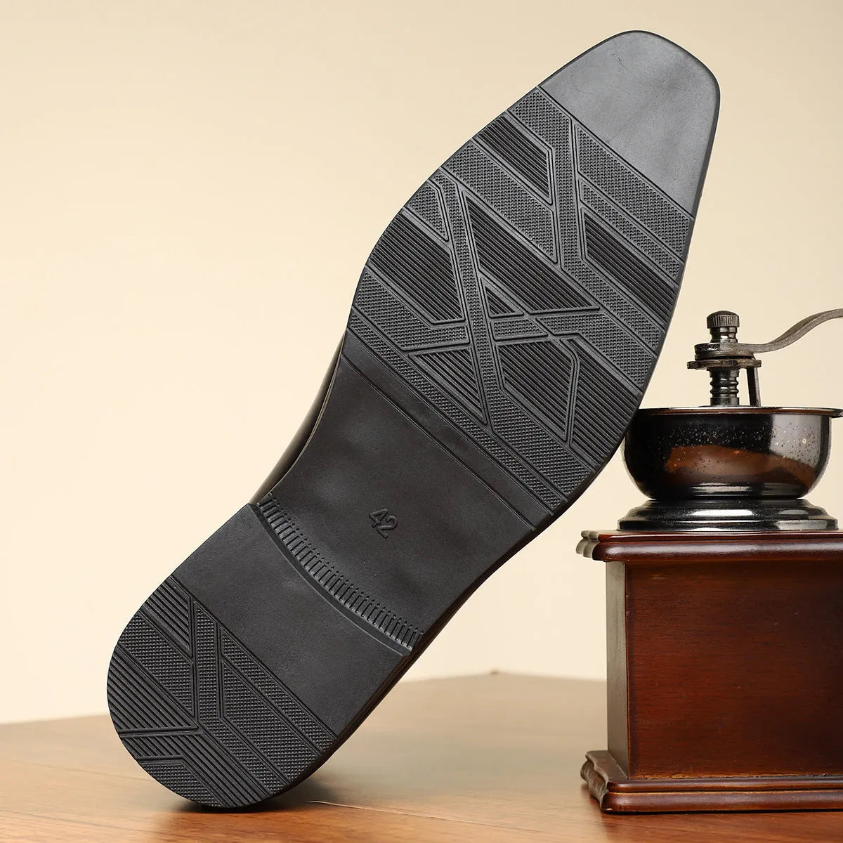 Brown retro men's formal shoe with side zip, square toe, and low square heel on a plain background.