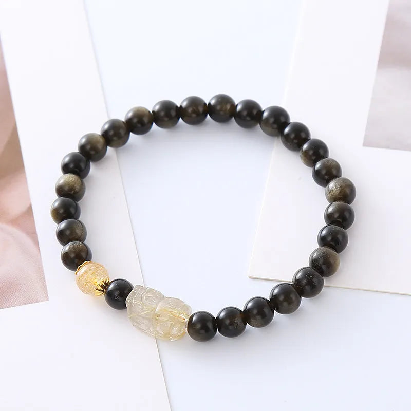 Handmade natural obsidian Pi Xiu bracelet with ethnic zodiac design in gold or red colours