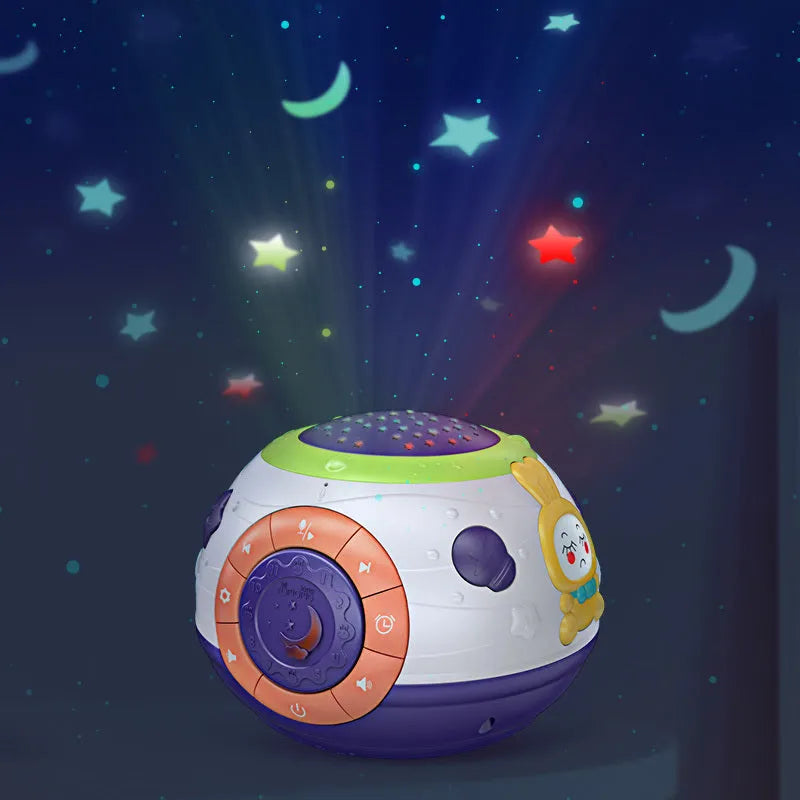 White plastic starry sky night light projector for children on a table, projecting blue stars onto a wall.