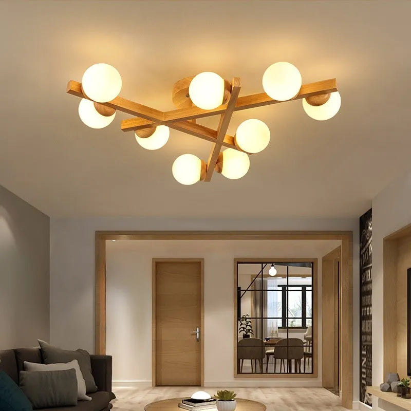 Modern three-headed pendant ceiling light with neutral bulbs in a Nordic style, suitable for a wooden living room.
