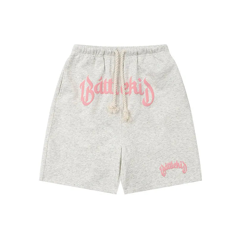 Cropped cotton-blend sweatpants shorts in loose casual street style.