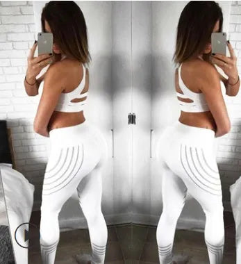Women's black workout leggings with a glowing print pattern on the legs.