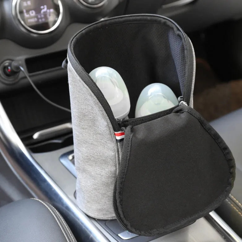 Grey Oxford cloth car USB baby bottle warmer with electronic display, shown with two bottles and car charger.