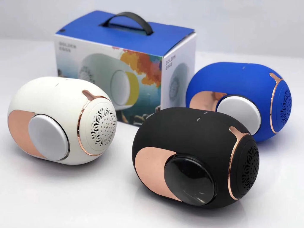 Small golden egg-shaped portable Bluetooth speaker in black, white, or blue colour.