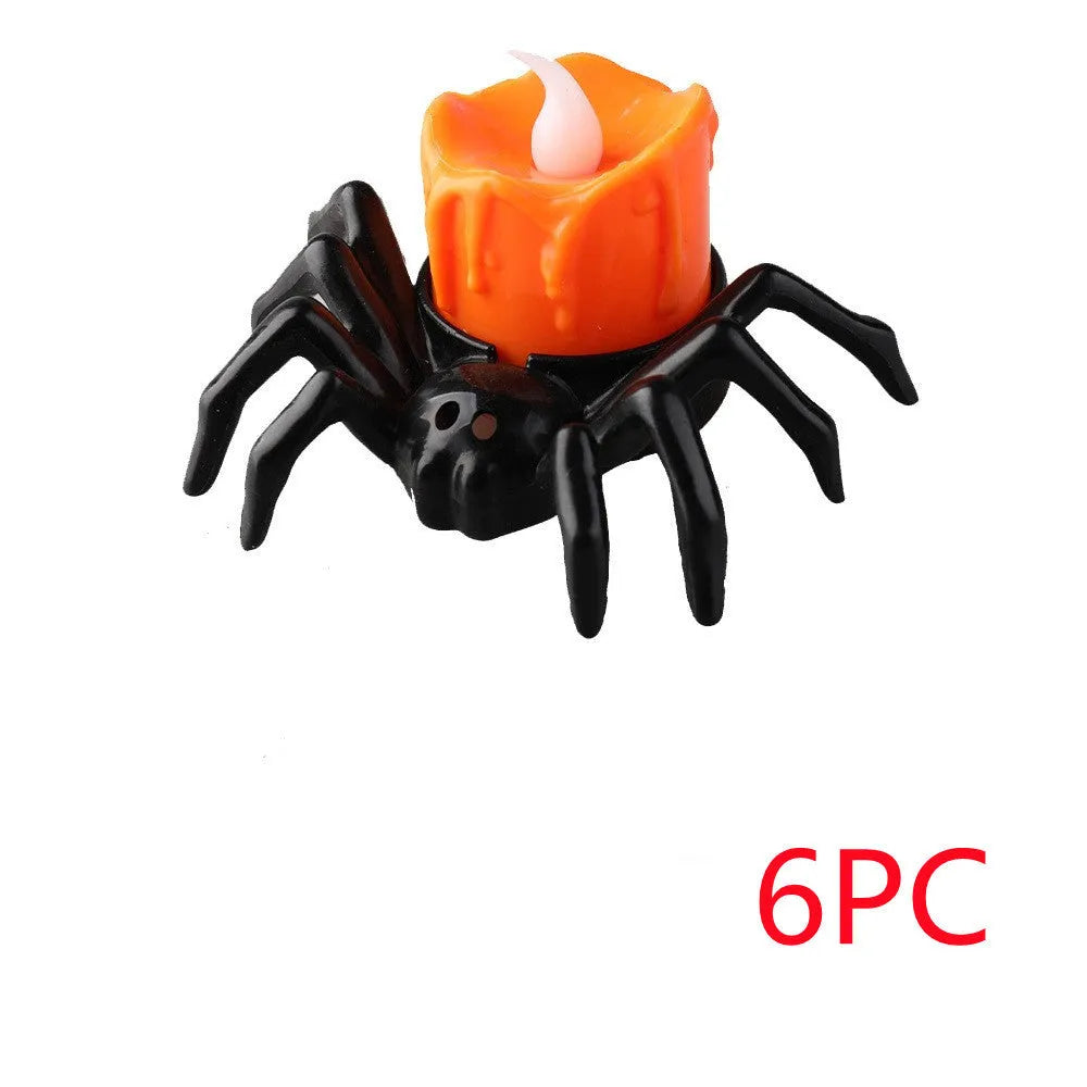 Plastic Halloween spider candlestick ornament with battery-operated candle light.