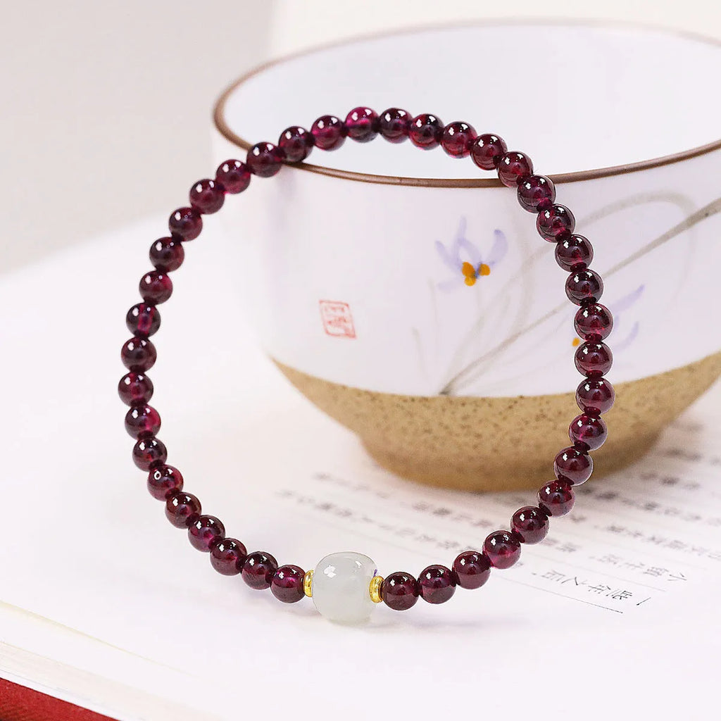 Natural garnet women's bracelet with U-shaped clasp showing 4mm and 6mm bead size options