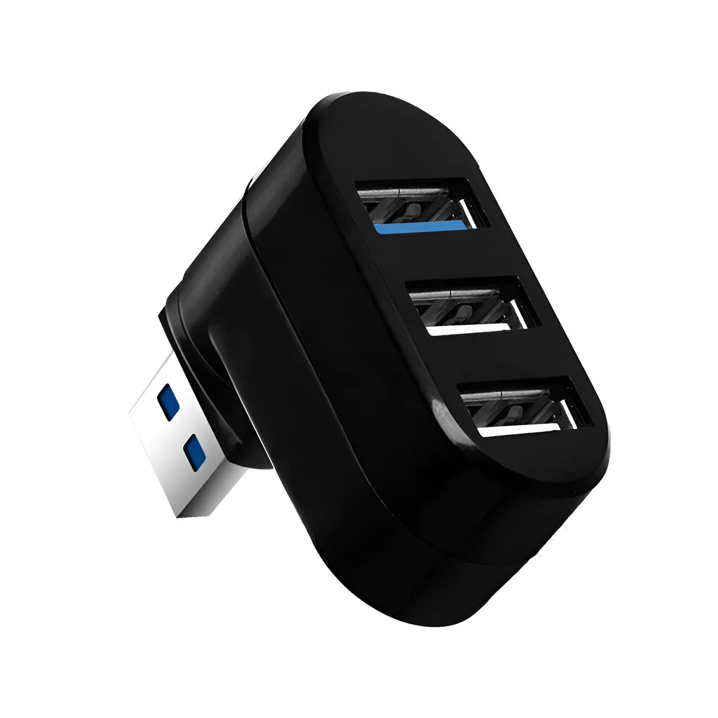 Black and white USB 3.0 four-port rotary splitter hub on a desk next to a laptop