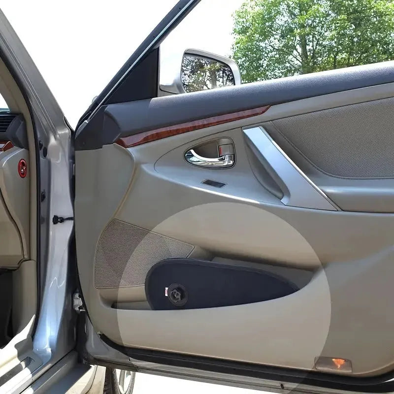 Black breathable mesh car window shade stretched over a car side window, showing suction cup attachment.