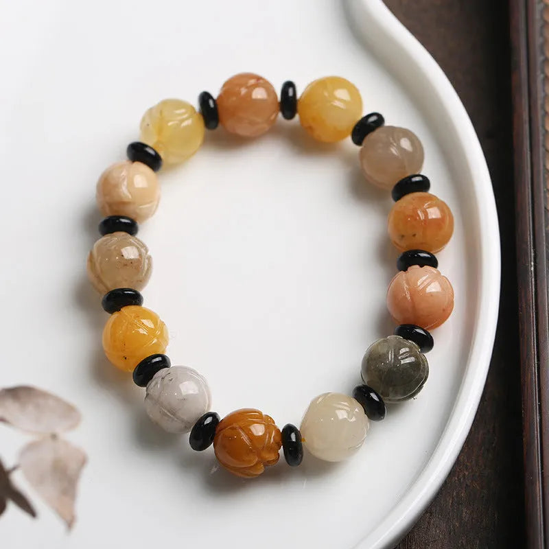 Hetian natural jinsi jade bracelet with geometric lotus pumpkin beads in 10mm or 12mm sizes.
