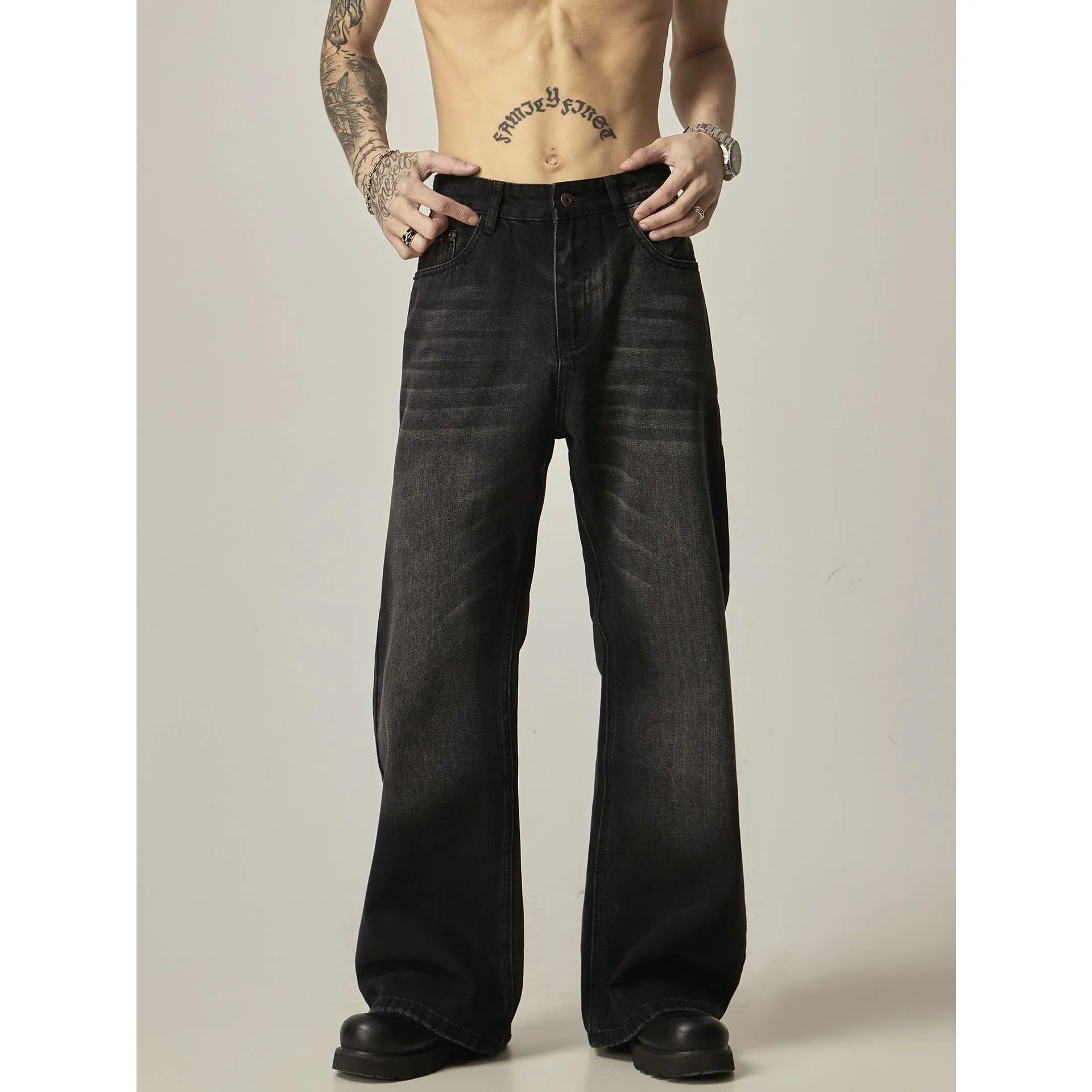 Black American retro loose straight jeans with zip fly opening on denim background